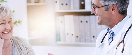 Friendly clinician engaging with a female patient