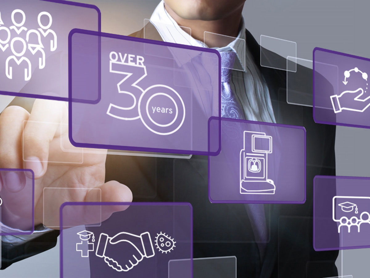 Person in a suit pointing at an 'Over 30 Years' icon